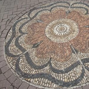 Scotland, Edinburgh. Historic Rose Street, with stone mosaic rose design in street