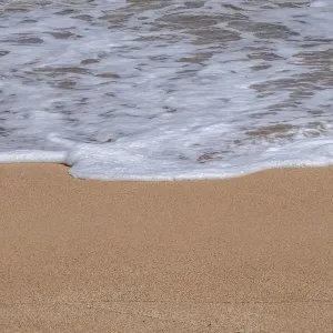 Sea foam on Golden sandy beach