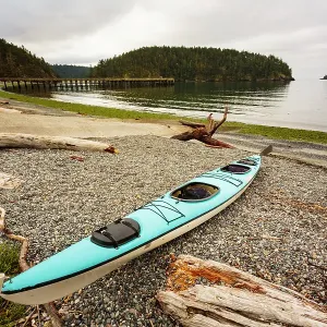 Sea kayak on the shore of Bowman Bay, Deception Pass State Park, Washington State, USA Sea kayak on the shore of Bowman Bay, Deception Pass State Park, Washington State, USA