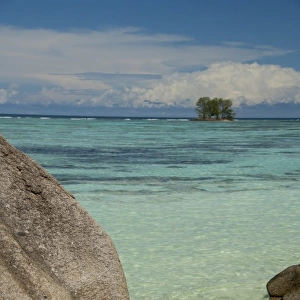 Seychelles, Island of La Digue. Anse Source D Agent beach, bikini drying on rock