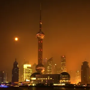Shanghai Pudong Chna Skyline at Night with TV Tower with Moon and Reflections Orange Shanghai Pudong Chna Skyline at Night with TV Tower with Moon and Reflections Orange