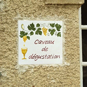 A sign outside the tasting room saying caveau de degustation. Chateau Mourgues du Gres Gres