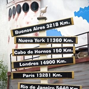 Sign showing distances in kilometers from Ushuaia on the island of Tierra del Fuego, Argentina