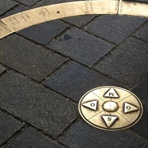 Slovakia, Bratislava. Mile marker zero set in cobblestone street below St. Michaels Gate