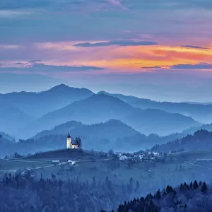 Slovenia, Poljane Sora Valley, hillside church near Gorenja Vas in early morning light