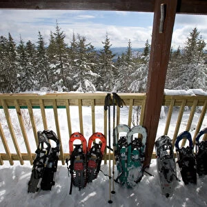 Snowshoes on the front porch of the Appalachian Mountain Clubs Hi-Cabin on Mount