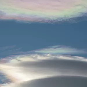 South Georgia, St. Andrew's Bay, Cloud iridescence or irisation, aka rainbow clouds. Common type of photometeor. Lenticular clouds