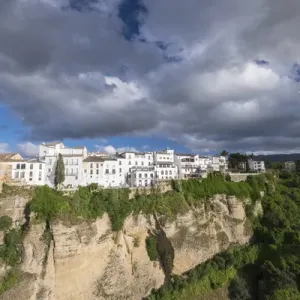 Spain, Andalusia. Ronda perches on the rugged defensible limestone cliffs Spain, Andalusia. Ronda perches on the rugged defensible limestone cliffs