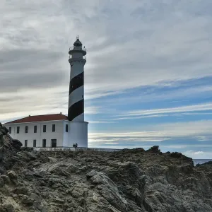 Spain, Menorca. Lighthouse at Cavalleria at sunrise