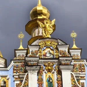 St. Michaels Golden-Domed Monastery, Steeple Spire Facade, Kiev, Ukraine. Saint Michaels is a functioning Greek Orthodox Monastery in Kiev. The monastery was created in the 1100s but was destroyed by the Soviet Union in the 1930 s