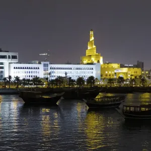 State of Qatar, Doha. Dhow harbor at night. Left: Ministry of Finance