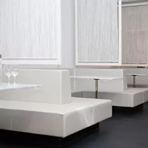 Stockholm, Sweden - Bench style booth seating in a restaurant. The tables, seating