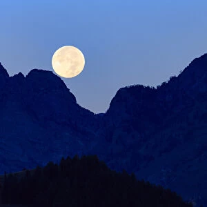 Super moon setting over the Grand Teton Mountain Range, Grand Teton National Park