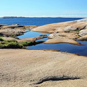 Sweden, Bohuslan, Ramsviklandet Nature Preserve. Polished rock slabs along the coast
