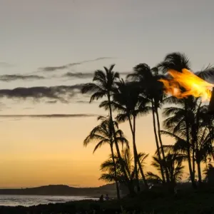 Tiki torches at Sunset on Poipu beach Kauai, Hawaii Tiki torches at Sunset on Poipu beach Kauai, Hawaii