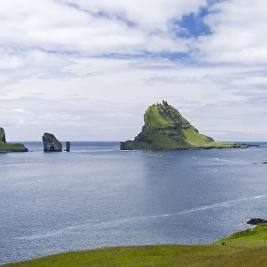 Tindholmur in the Sorvagsfjordur. The island Vagar, part of the Faroe Islands