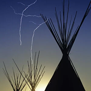 Tipis at sunset at Browning Montana (lightning added digitally)