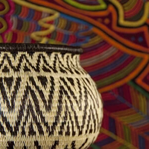 Traditional hand made Panamanian handicrafts. Embera Indian grass basket in front