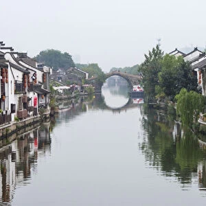 Traditional house and stone bridge on the Grand Canal, Wuxi, Jiangsu Province, China