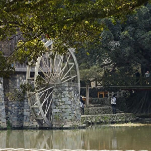 Traditional house and water wheel by the river in Yunshuiyao Village, Nanjing County