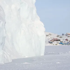 The traditional and remote Greenlandic Inuit village Kullorsuaq located at the Melville The traditional and remote Greenlandic Inuit village Kullorsuaq located at the Melville