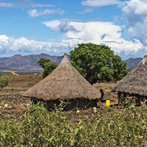 Traditional village houses with thatched roof with farmland in the mountain, Konso