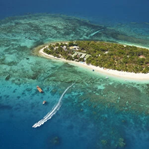 Treasure Island Resort and boat, Mamanuca Islands, Fiji, South Pacific - aerial
