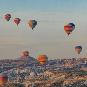 Turkey, Anatolia, Cappadocia, Goreme. Hot air balloons flying above / among rock formations Turkey, Anatolia, Cappadocia, Goreme. Hot air balloons flying above / among rock formations