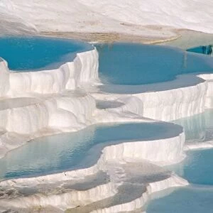 Turkey, Pamukkale (Cotton Castle). Limestone-laden hot springs form white pools with