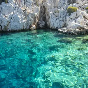 Turquoise colored crystal clear water at a rocky island, Aegean Sea, Turkey Turquoise colored crystal clear water at a rocky island, Aegean Sea, Turkey