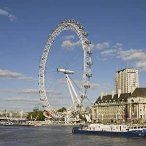 UK, London. London Eye ferris wheel on the banks of the Thames River