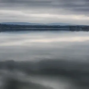 US, TN, Watts Bar Lake. Glass calm reflects cloud patterns