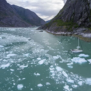 USA, Alaska, Aerial views / V Abuelos motoring among icebergs floating near calving face