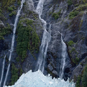 USA, Alaska, Tracy Arm - Fjords Terror Wilderness, Waterfall behind deep blue glacial