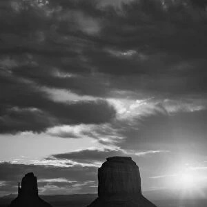 USA, Arizona, Monument Valley. Black and white of sunrise silhouettes of formations