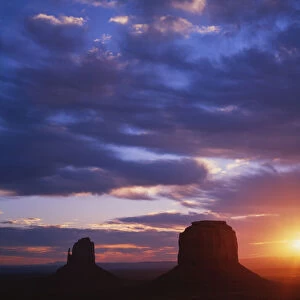 USA, Arizona, Monument Valley. Sunrise silhouettes of formations