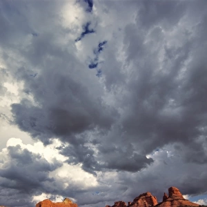 USA, Arizona, Oak Creek Canyon. Menacing clouds race through the red rocks of Oak