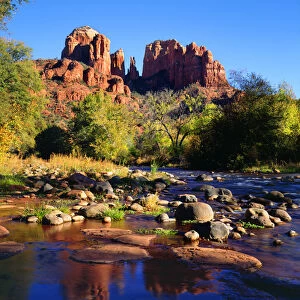 USA, Arizona, Sedona, Cathedral Rock reflecting in Oak Creek