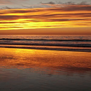 USA, California, La Jolla, Sunset reflected on beach at La Jolla Shores