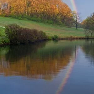 USA, Delaware, Wilmington. Rainbow reflects in Winterthur Garden pond
