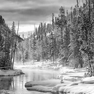 USA, Gibbon River, Yellowstone National Park. Steam rises from the Gibbon River in winter