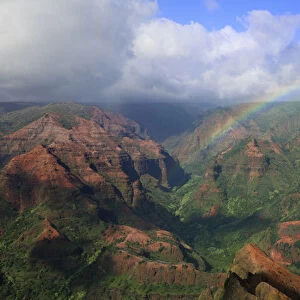 USA, Hawaii, Kauai. Rainbow and clouds over Waimea Canyon