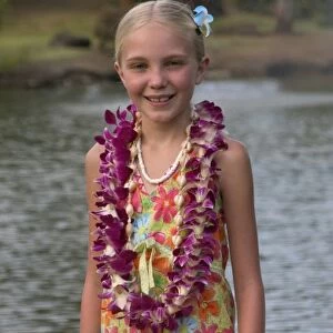 USA, Hawaii, Kauai, Smith Family Luau, girl tourist with lei at luau. (MR) (RF)