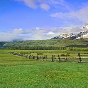 USA, Idaho, Sawtooth National Recreation Area. Landscape with split-rail fence. Credit as