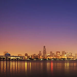 USA, Illinois, Chicago. Sunset skyline and Lake Michigan