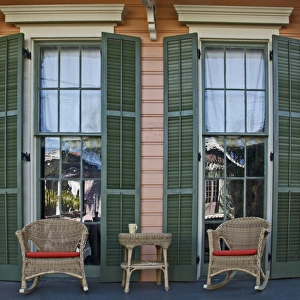 USA, Louisiana, New Orleans, Garden District. Two rocking chairs and a coffee mug