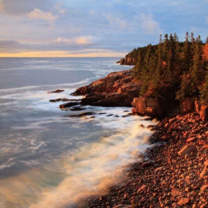 USA; Maine; Acadia National Park; Ocean waves breaking on rocks along Ocean Drive