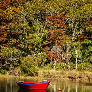 USA, Massachusetts, Cape Cod, Red dory on Herring River