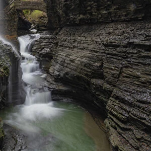 USA, New York, Watkins Glen. Waterfall cascade over rock