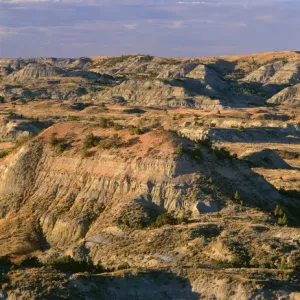 USA, North Dakota, Theodore Roosevelt National Park, Evening light defines eroded